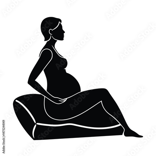 Silhouette of pregnant woman relaxing and sitting on a cushion in black and white style for design