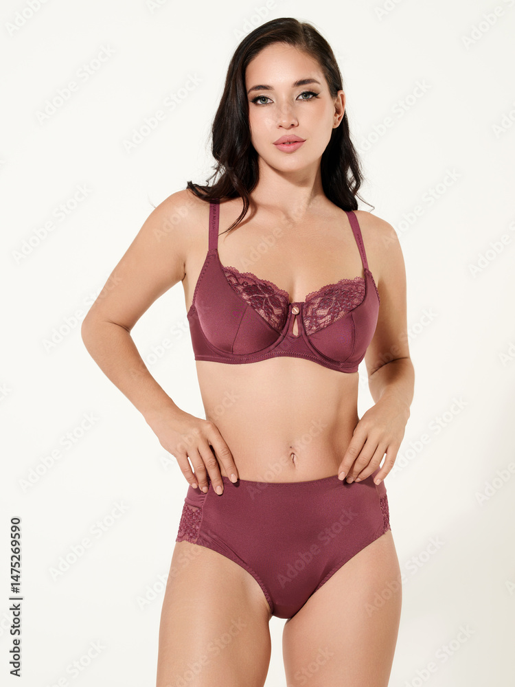 Fototapeta premium Sexy girl model in a beautiful swimsuit, fashion shooting in the studio.