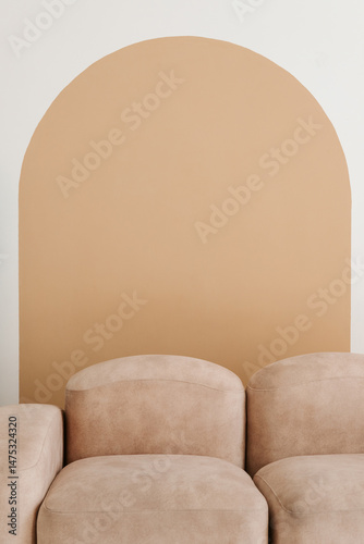 Interior of light modern living room with beige couch
