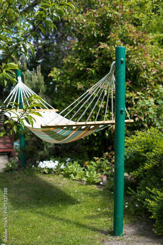 Obraz na płótnie Hammock, rest and recreation in the garden.
w salonie