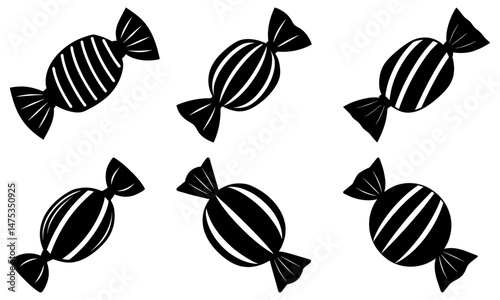 Illustration of six black and white wrapped candies with striped patterns in a scattered arrangement