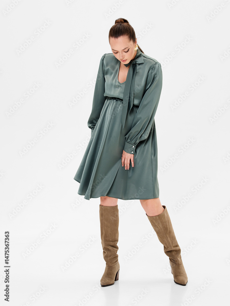 Pregnant girl model in stylish clothes on white background in studio. Pregnant girl model in stylish clothes on white background in studio.