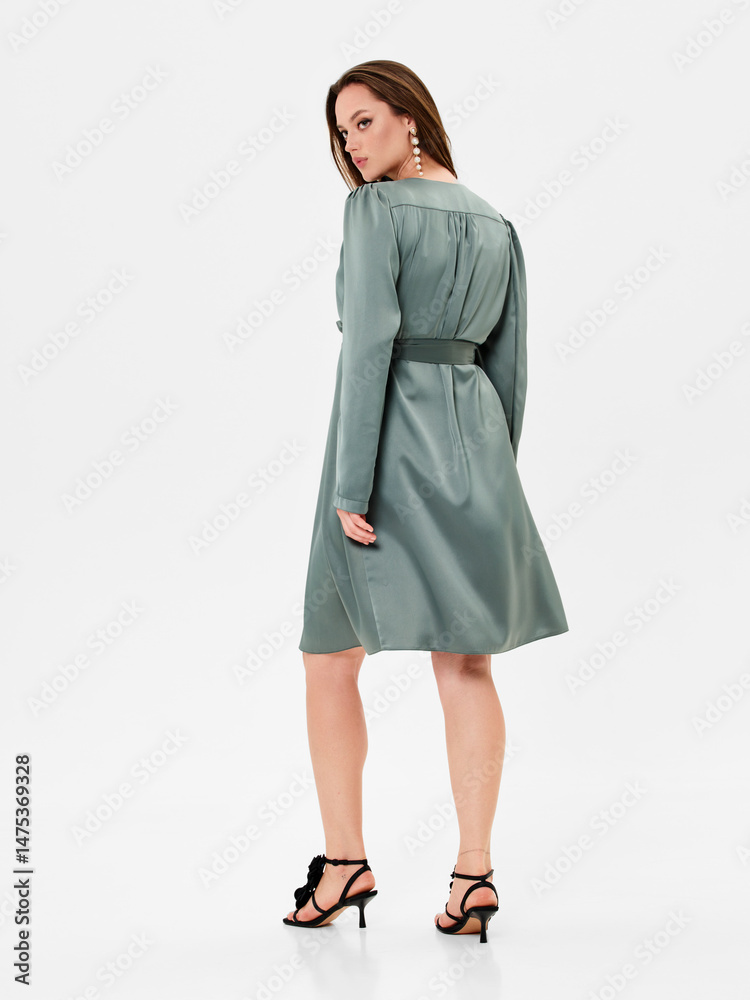 Pregnant girl model in stylish clothes on white background in studio. Pregnant girl model in stylish clothes on white background in studio.