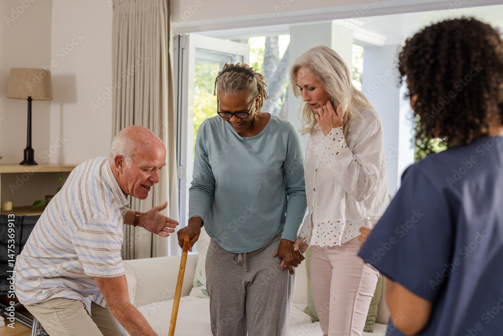 Fototapeta premium Senior friends supporting each other while African American woman using walking cane
