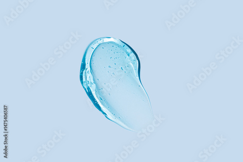 Clear blue gel texture with air bubbles on light background