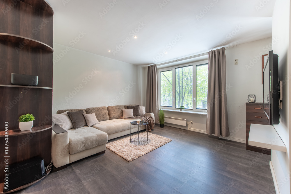 Fototapeta premium Modern Home Living Room Interior with Large Windows and Comfortable Furniture