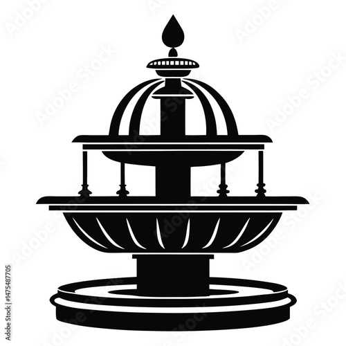 A captivating black water fountain stands isolated gracefully against the plain white background perfectly