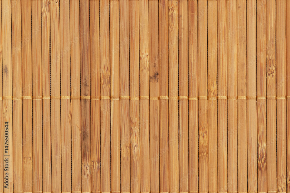 Fototapeta premium Natural light brown wooden bamboo mat background