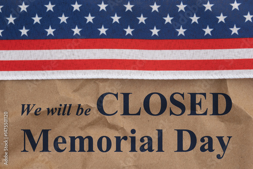 Closed Memorial Day sign with retro USA red, white and blue star and stripes on crumpled paper