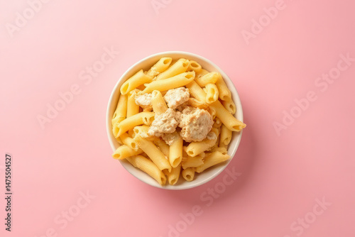 Minimalist Chicken Alfredo Pasta Photography: Soft Pink Background, Clean Style, Moody Low Key Radiance, High Resolution