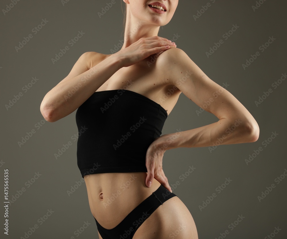 Fototapeta premium Woman with perfect slim body on grey background, closeup