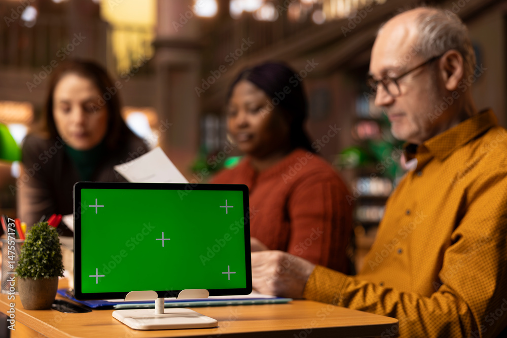 Fototapeta premium Team of calm and composed mature people studying next to copy space in a campus library, education and wisdom grows stronger with age. Older students group finishing their studies.