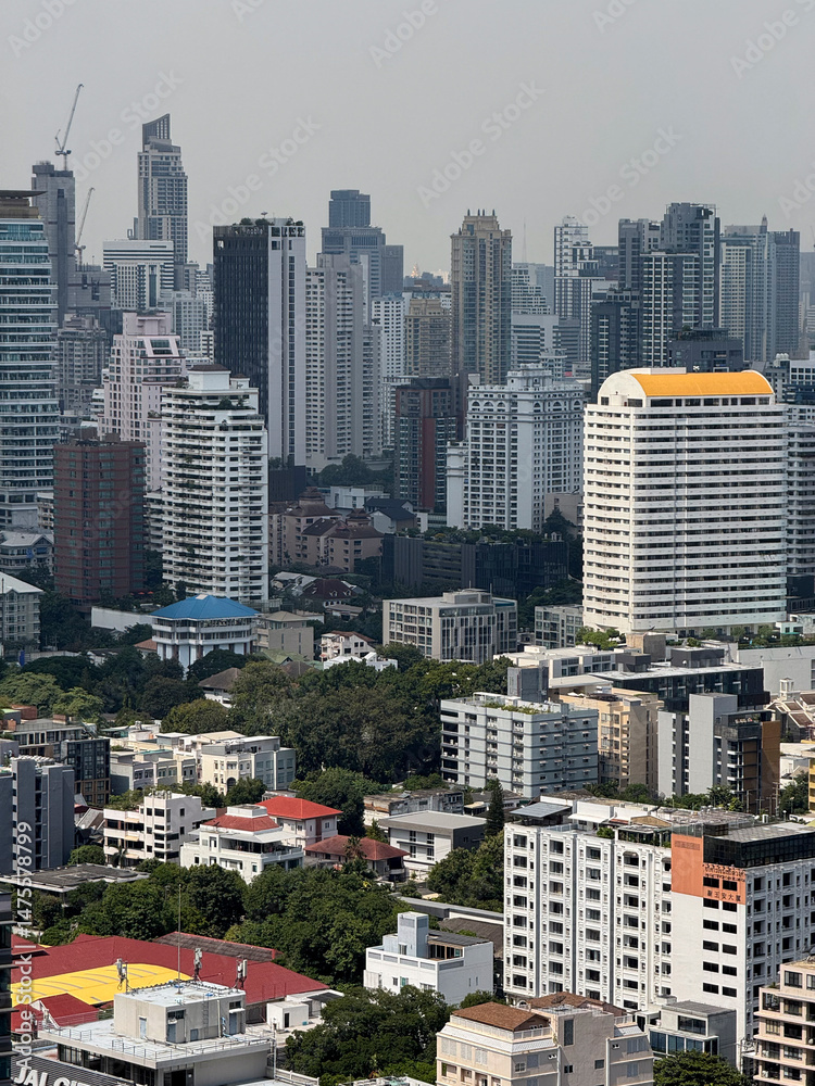 Obraz premium Thailand skyscrapers towers and the bustling city center lifestyle, downtown area with breathtaking huge office buildings and infrastructure. Urban landscape in the exotic metropolis.