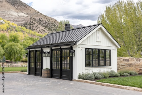 Charming White Farmhouse with Black Trim and Lush Landscaping