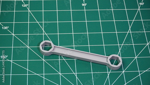 Green cutting mat with measurement grid lines, used for crafting, sewing, DIY projects, and precision cutting work.