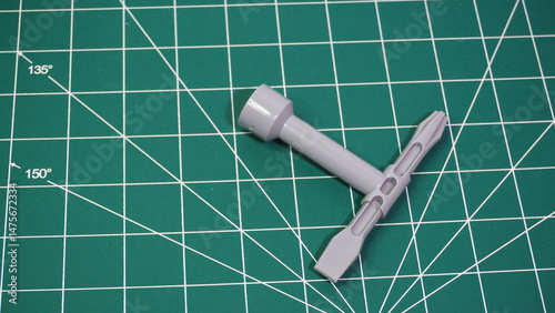 Green cutting mat with measurement grid lines, used for crafting, sewing, DIY projects, and precision cutting work.