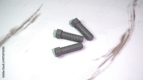 Metal bolts isolated on white background, industrial hardware concept for construction, repair, and mechanical engineering.