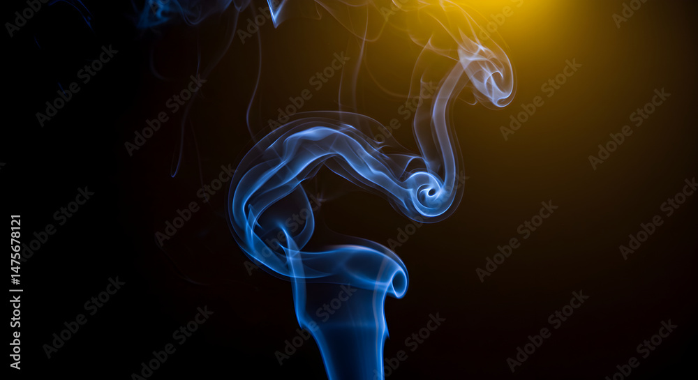 Naklejka premium Serpentine Blue Smoke Wisp Against Dark Backdrop With Golden Light Effect