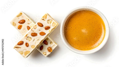 Delicious nougat candy bars and a cup of espresso coffee on a white background a perfect treat for coffee lovers