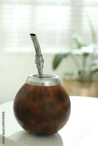 Traditional yerba mate tea on white table indoors