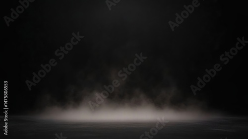 A dark, empty space with a subtle layer of mist or smoke hovering above a textured surface.