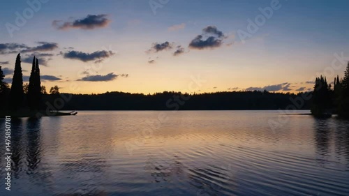 Sunset over a calm sea. Ideal for nature themes, peaceful visuals, and scenic landscapes. Golden hour, reflection.