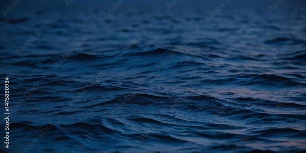 Naklejka premium Abstract View of Deep Blue Ocean Waves Texture Background for Powerful and Natural Scenes