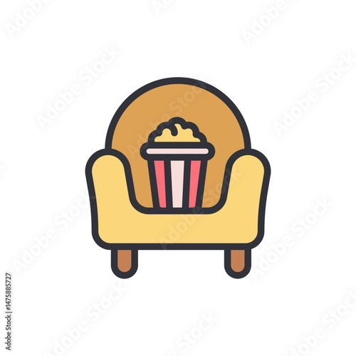 Cozy Movie Night Featuring An Armchair And Bucket Of Popcorn