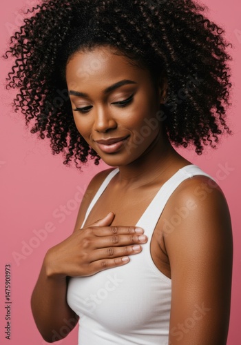 Obraz na płótnie Elegant woman in white tank top on pink background - confidence and beauty concept w salonie