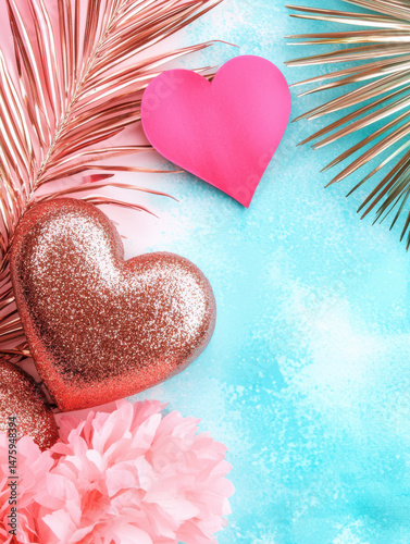 Glittery hearts and tropical leaves create vibrant scene