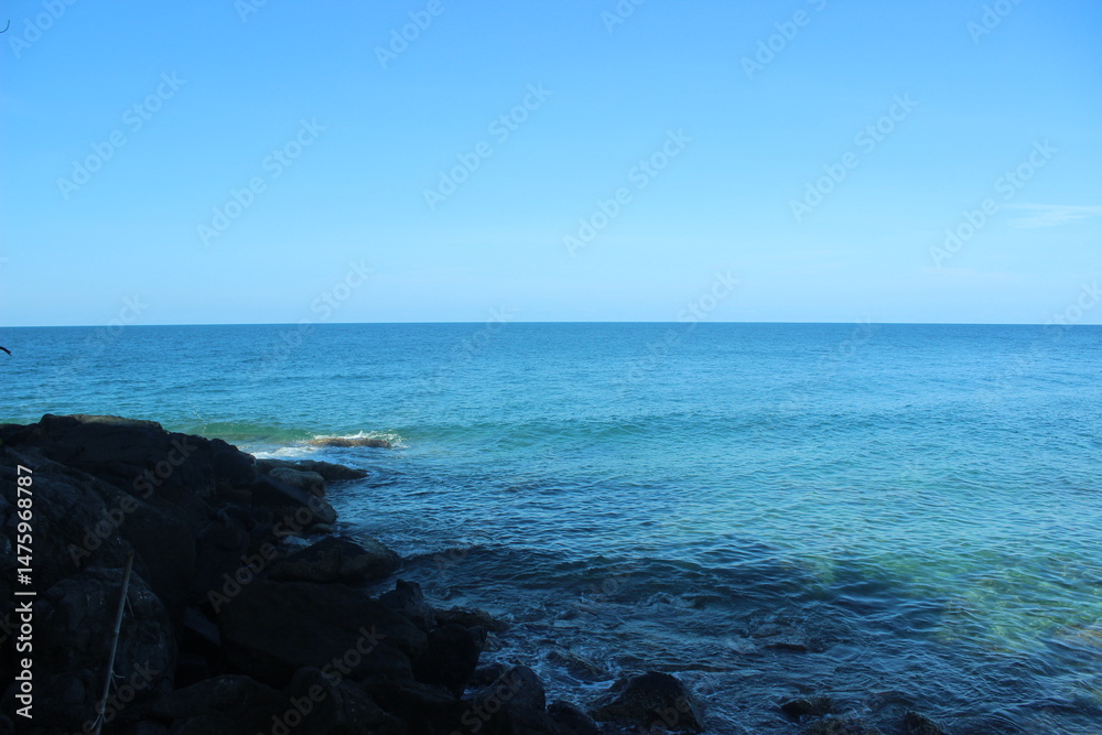 Sunlight dances on crystal-clear waters, capturing the essence of summer bliss, ideal for beach vacation promotions or wellness visuals Sunlight dances on crystal-clear waters, capturing the essence of summer bliss, ideal for beach vacation promotions or wellness visuals