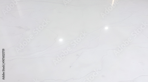 Surface of a polished marble floor, emphasizing the smooth finish and natural veining