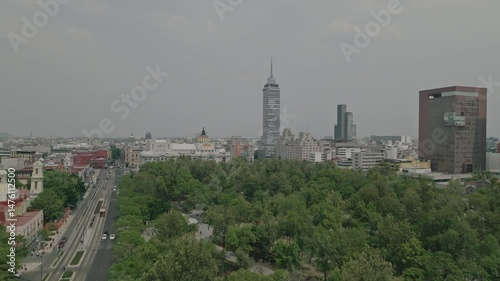 Short aerial shot over tree-covered roundabout in Alameda Central