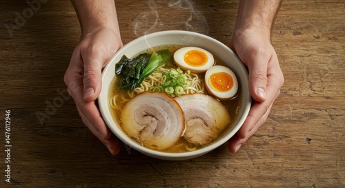 Bowl of ramen held in hands