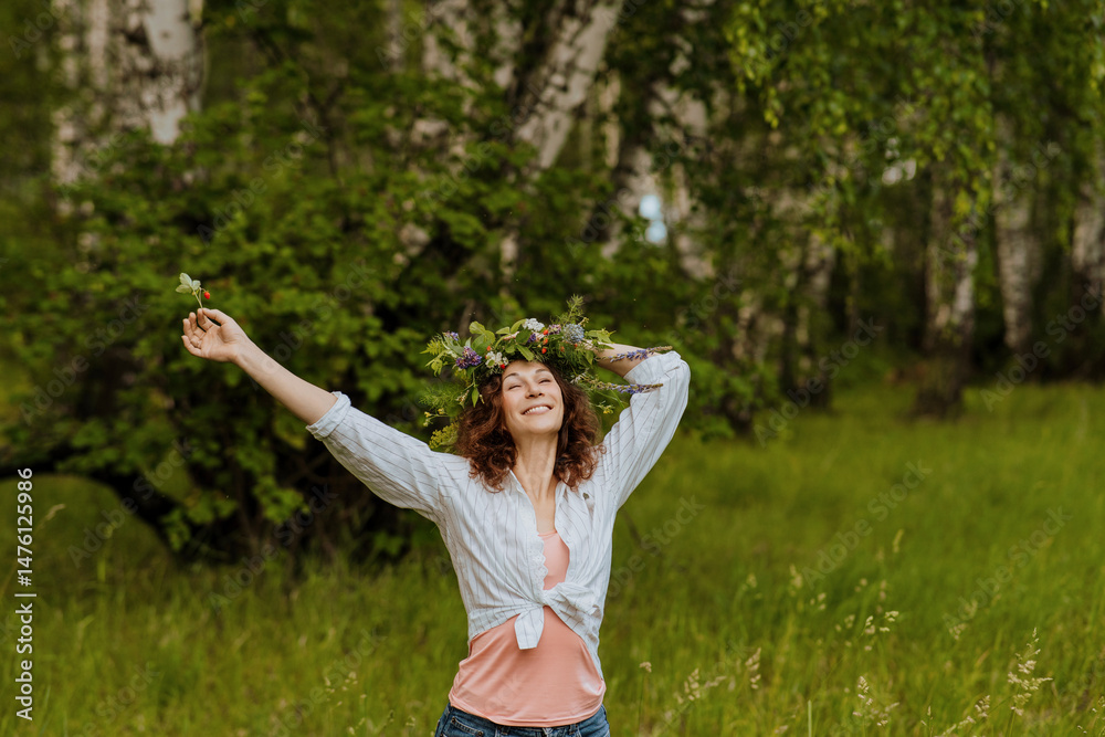 Happy Slavic woman with wildflower wreath celebrating Ivan Kupala in countryside Happy Slavic woman with wildflower wreath celebrating Ivan Kupala in countryside