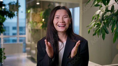 Happy surprised Asian businesswoman amazed shocked Chinese Korean Japanese business woman shock open mouth amazing impress excited female manager wow unbelievable good news job offer in office company
