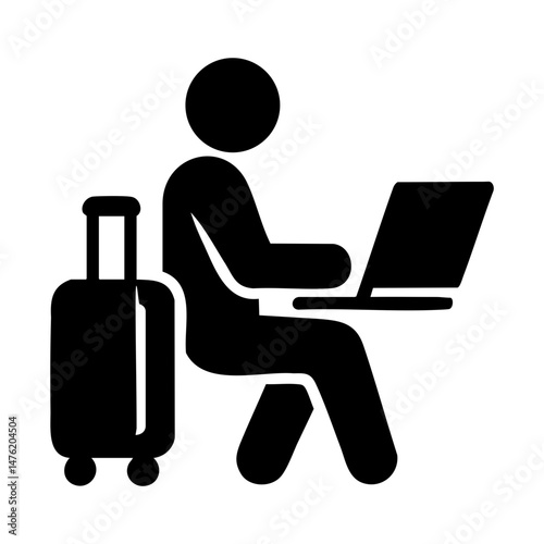 Traveler using laptop at airport terminal
