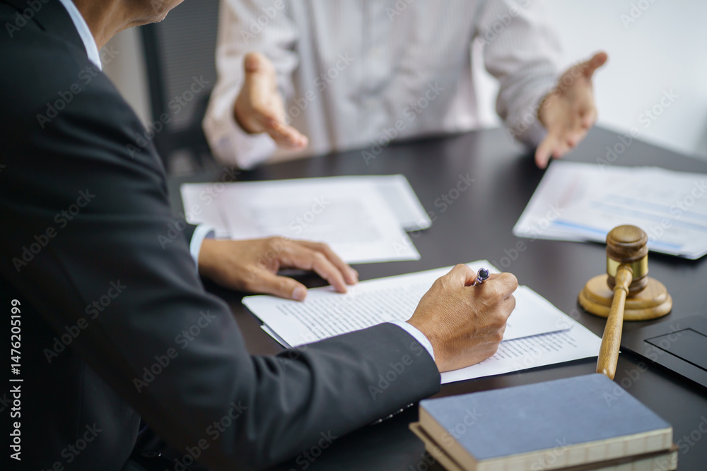 Lawyer Legal counsel presents to the client a signed contract with gavel and legal law. justice and lawyer Business partnership meeting concept. Lawyer Legal counsel presents to the client a signed contract with gavel and legal law. justice and lawyer Business partnership meeting concept.