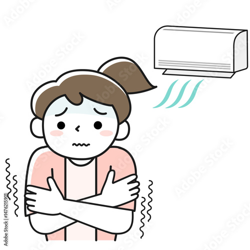 冷房が効きすぎて寒さに震える女性
