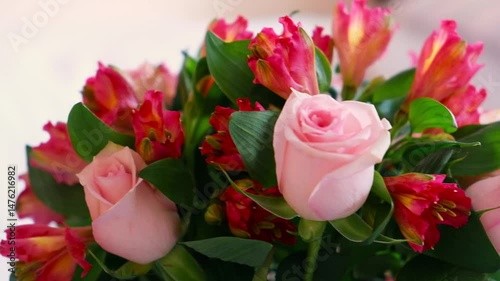 Beautiful bouquet of red roses and alstermeria. High quality FullHD footage