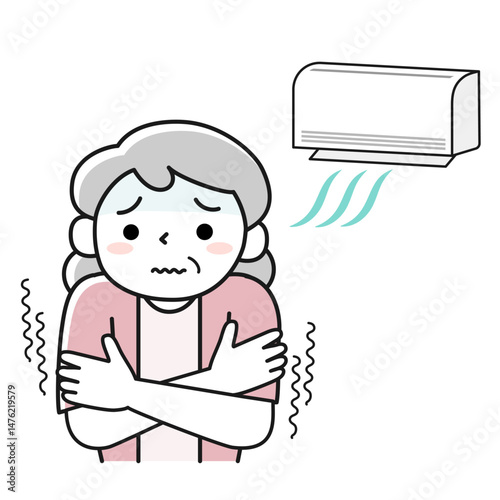 冷房が効きすぎて寒さに震える高齢女性