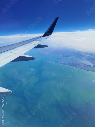Airplane's wing. Amazing view flying over Persian gulf