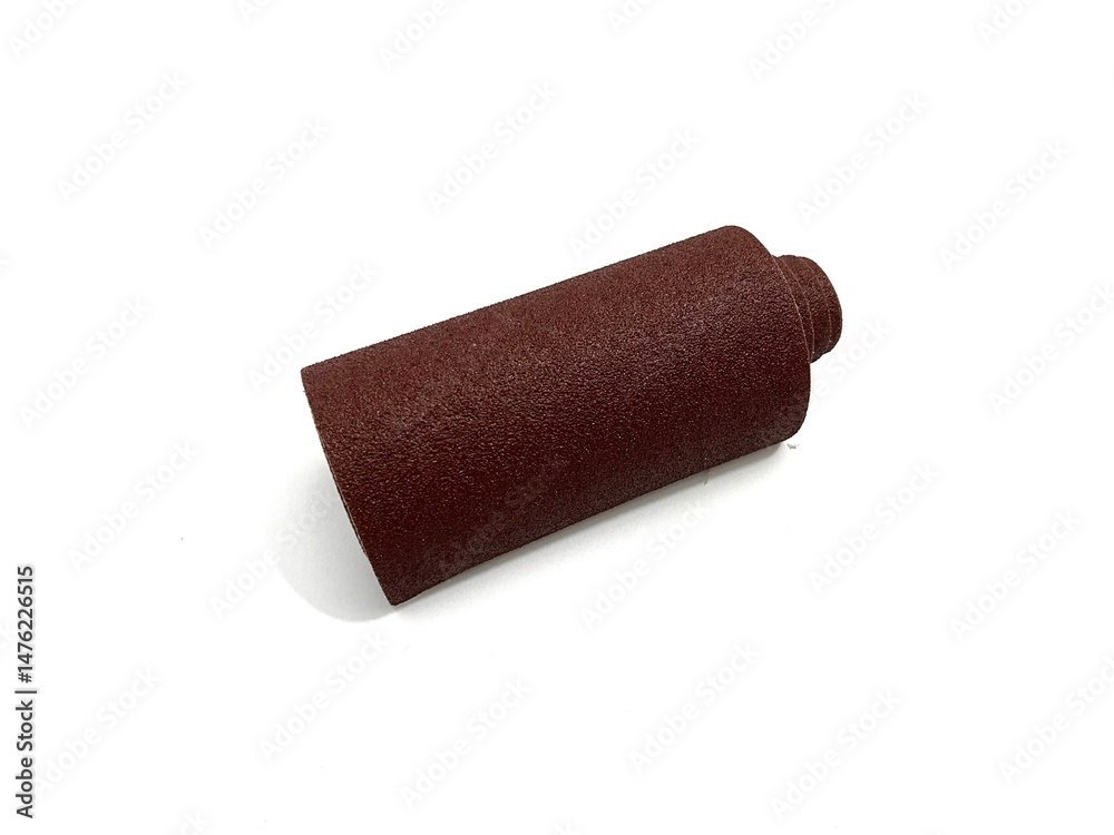 Obraz premium Brown sandpaper roll for surface smoothing and polishing. Ideal for woodworking, metal, and DIY projects. Abrasive tool photography isolated on white background.
