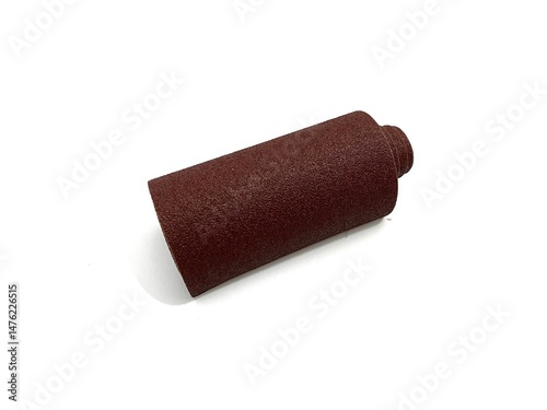 Brown sandpaper roll for surface smoothing and polishing. Ideal for woodworking, metal, and DIY projects. Abrasive tool photography isolated on white background.