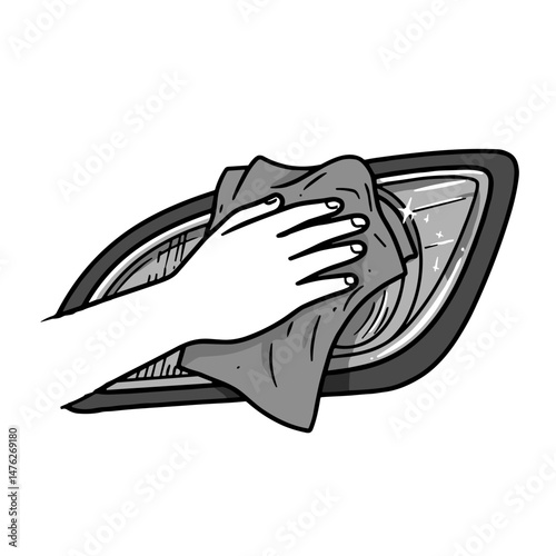 Hand cleaning car headlight with cloth  