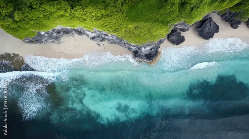 Stunning drone shot of Uluwatu Beach, Bali, featuring turquoise waters, rugged cliffs, and rocky coastline. Ideal for nature travel and landscape projects.