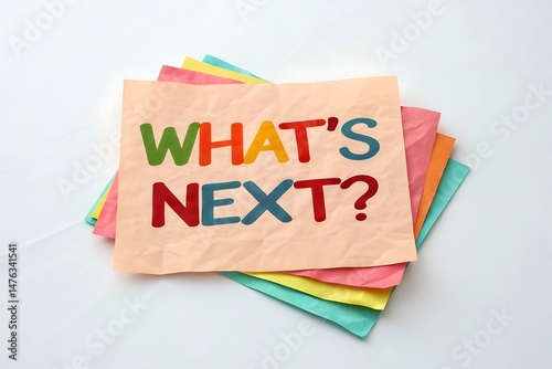 “What’s Next” question on note paper – inspirational flat lay