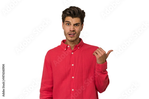 Young handsome caucasian man isolated on white background shocked pointing with index fingers to a copy space.