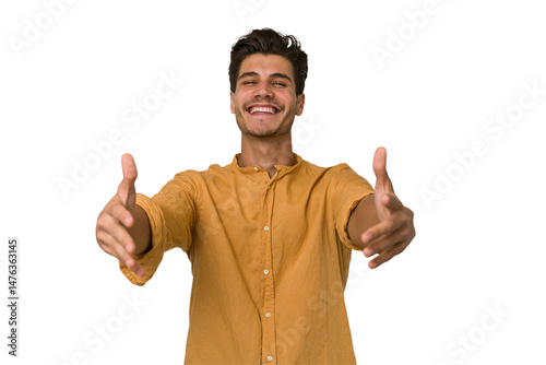 Young handsome caucasian man isolated on white background showing a welcome expression.