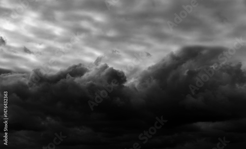 dark dramatic sky with black stormy clouds before rain as abstract background, extreme weather